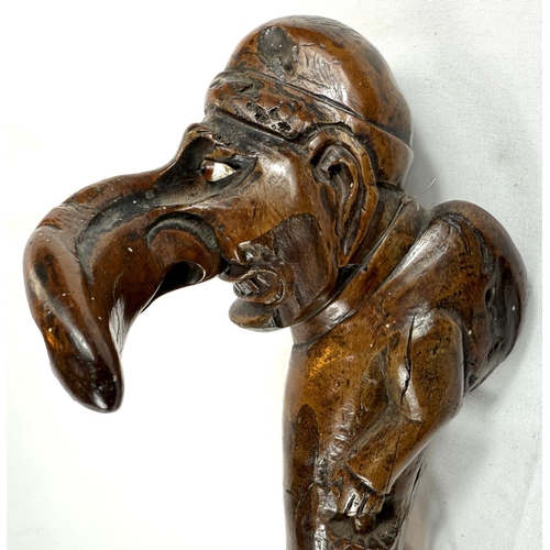 71 - A 19th Century carved wood stick with 'Mr Punch' finial, 77cms.