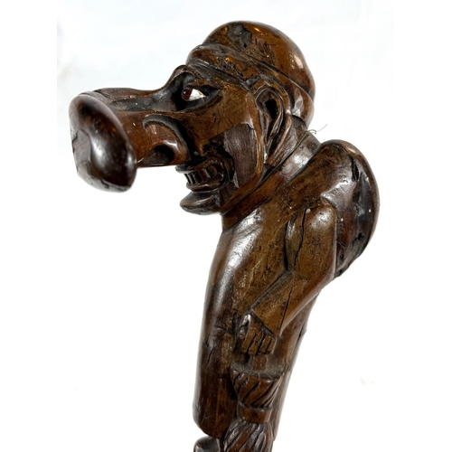 71 - A 19th Century carved wood stick with 'Mr Punch' finial, 77cms.