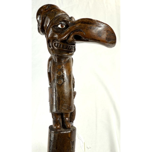 71 - A 19th Century carved wood stick with 'Mr Punch' finial, 77cms.