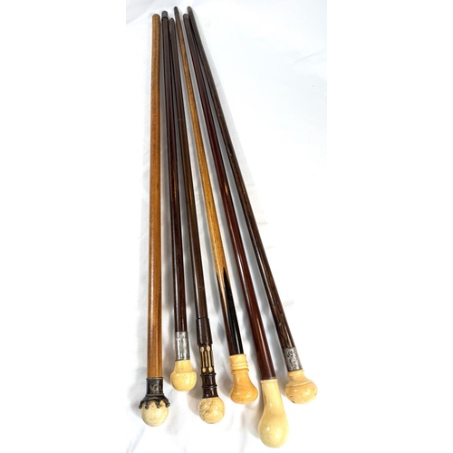 8 - A 19th Century Malacca cane with metal-mounted ivory ball finial, 87cms, and five similar sticks (6)... 