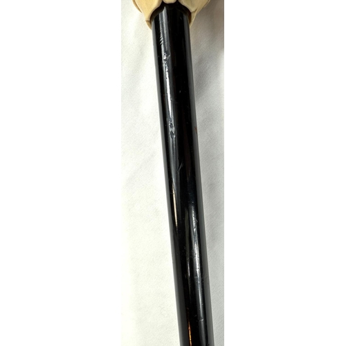 9 - A 19th Century walking stick with carved ivory finial of a bulldog in a driver's cap, 89cms.Submissi... 