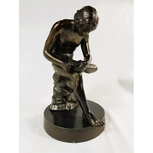 911 - A classical style bronze, naked athlete picking a thorn from his foot, height 22 cm.