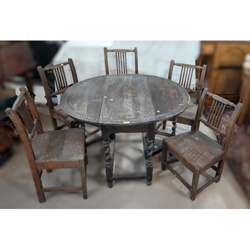 1018 - An 18th century oval oak drop leaf gateleg dining table with incised carved decoration and barley tw... 