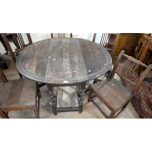 1018 - An 18th century oval oak drop leaf gateleg dining table with incised carved decoration and barley tw... 