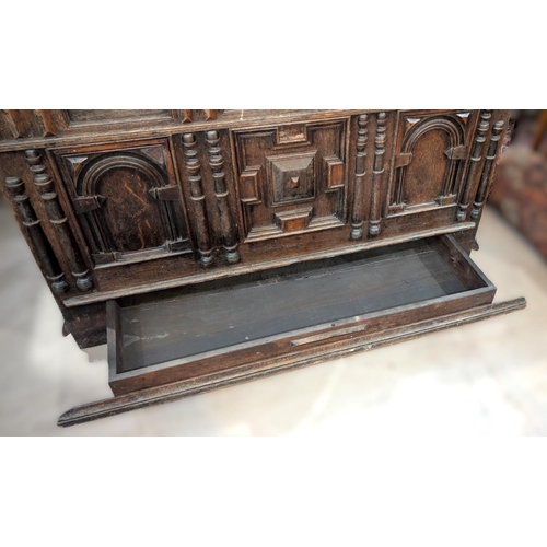 1021 - An 18th century oak framed and panelled blanket box with plank top and 3 arched panels to the front,... 