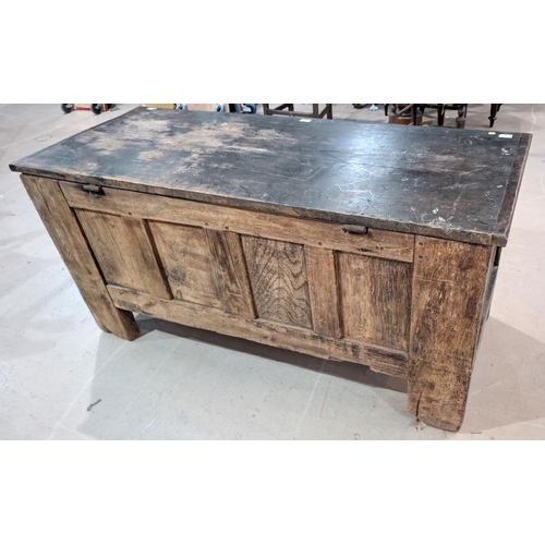 1024 - A large 18th century oak carved two panel top blanket box with four carved panels, scrolling grape a... 