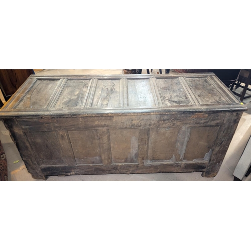 1029 - A large late 17th/early 18th century framed and panelled oak coffer with 5 panel front and blind fre... 