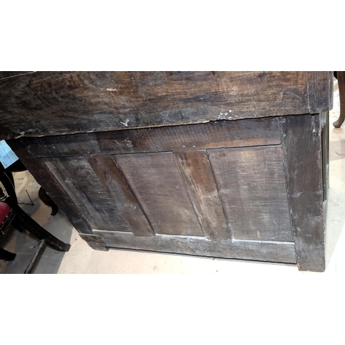 1030 - A late 17th/early 18th century framed and panelled oak blanket box with plank top carved frieze and ... 