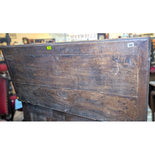 1030 - A late 17th/early 18th century framed and panelled oak blanket box with plank top carved frieze and ... 