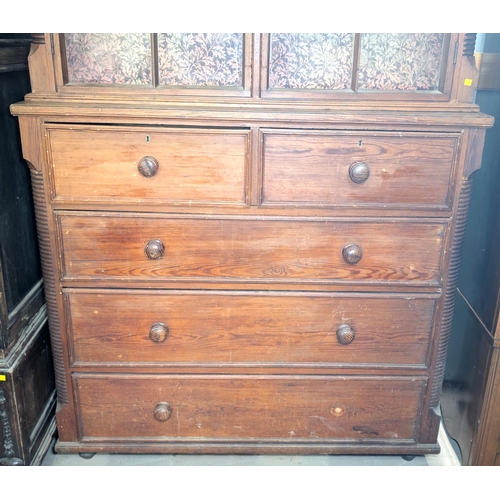 1031 - A Victorian full height pitch pine book case with reeded side pillars comprising upper section with ... 