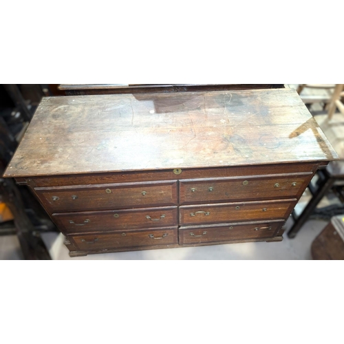 1036 - An 18th century country made crossbanded oak Lancashire chest with hinged top, 4 short drawers and 2... 