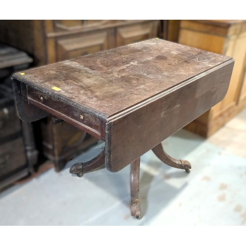 1039 - An early 19th century mahogany Pembroke table with false frieze drawer on central turned column and ... 