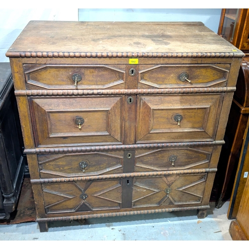 1042 - An 18th century oak chest of drawers with beaded decoration and 4 long drawers with geometric mouldi... 