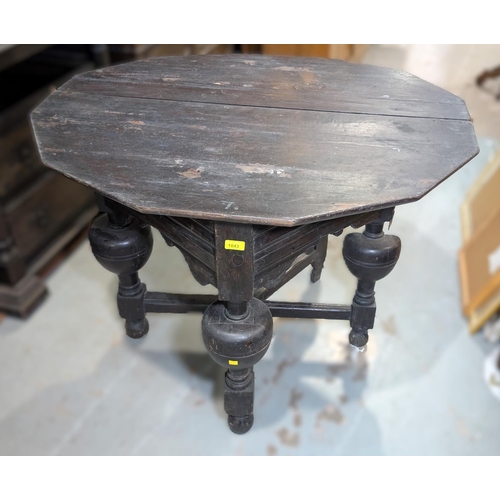 1043 - An 18th century canted oak fold over occasional table on heavy turned bulbous legs and cross stretch... 