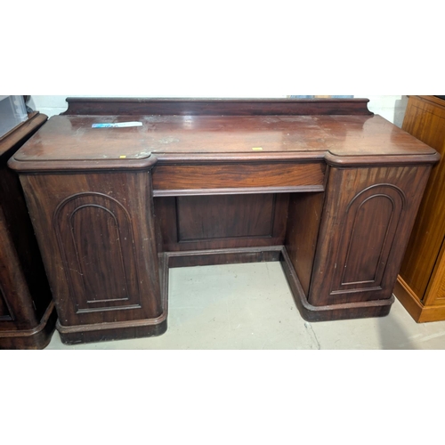 1049 - A Victorian mahogany twin pedestal sideboard with frieze drawer and 2 arched panel cupboards on plin... 