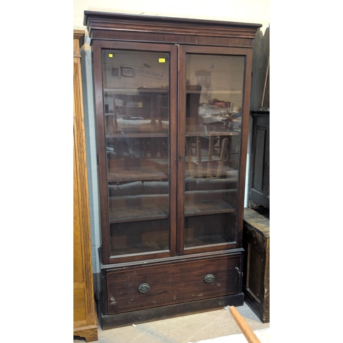 1074 - A late 19th/early 20th century mahogany full height display cabinet enclosed by 2 glazed doors with ... 