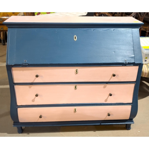 1092 - An antique painted fall front bureau with three drawers with swelling lower section in light pink an... 