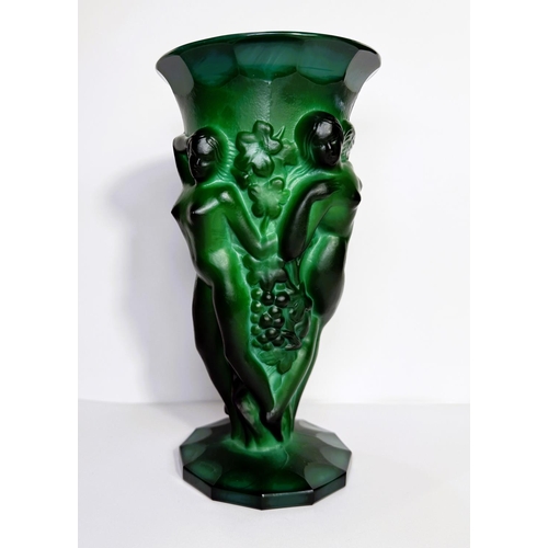 609 - A 1930's green malachite glass vase with three female nudes amongst fruiting vines, 21.5cm.