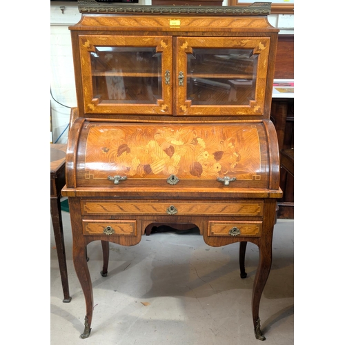 952 - A late 19th/early 20th century lady's cylinder bureau in the Louis XV manner with rosewood crossband... 