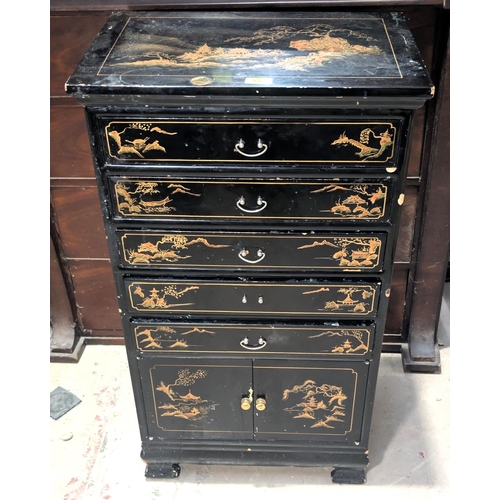 966 - A Japanese lacquer music cabinet with gilt decoration and five drawers and a cupboard below.