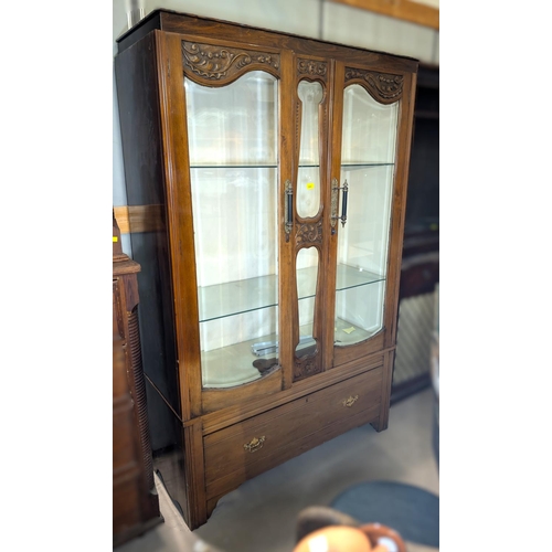 986 - An Edwardian walnut wardrobe converted to display cabinet and ended by two bevelled glass doors with... 