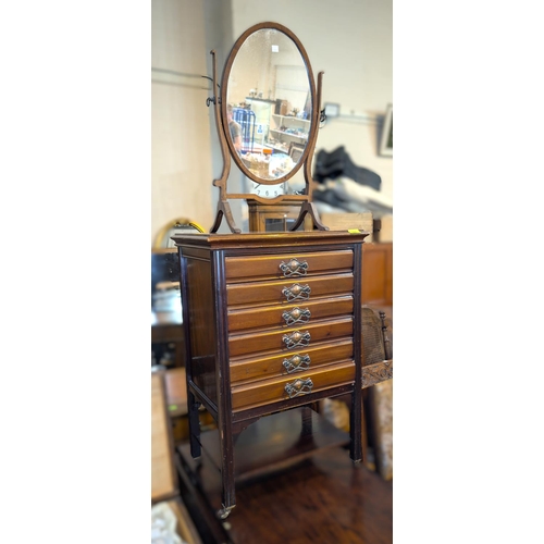 993 - An Edwardian mahogany music cabinet, 6 height and a dressing table mirror.