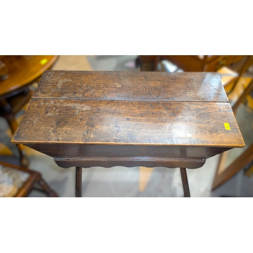 996 - An 18th century country oak bread kneading trough with lid, on four legs.