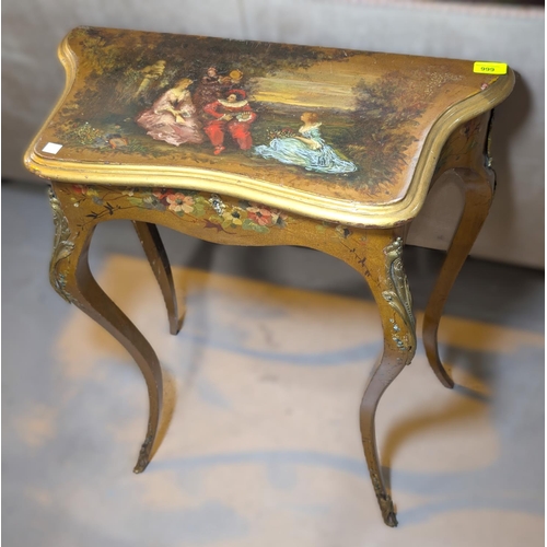 999 - A Louis XV style painted work table with musical  group to the top, brass fittings, hinge top.