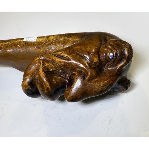 114 - A heavy natural wood finish staff with carved gargoyle finial, 112cm.