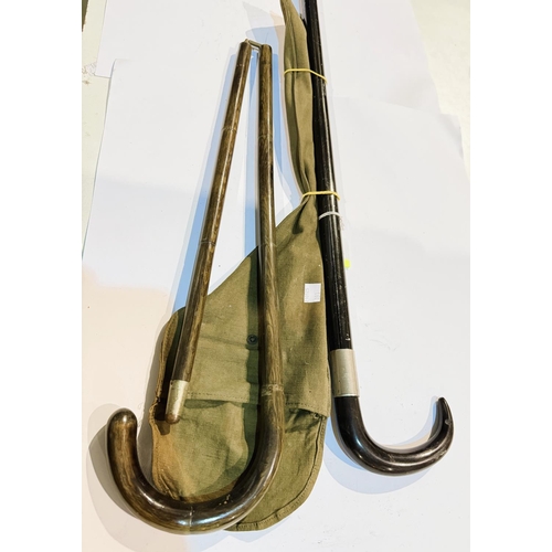 191 - A painted metal walking stick containing a camera tripod, 89cm, and a folding walking stick in canva... 