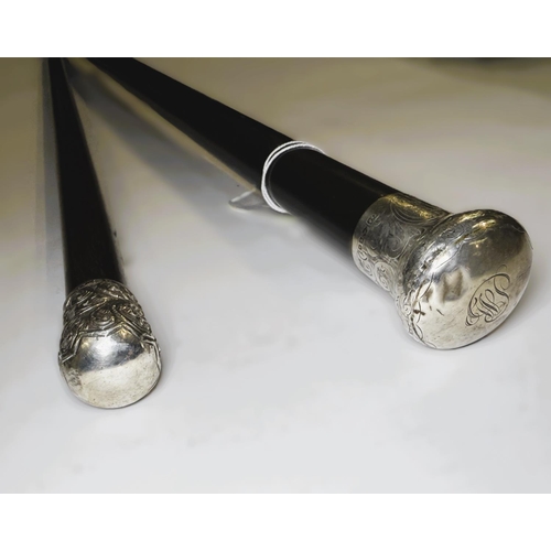 150 - Two Victorian ebony walking canes with hallmarked silver mounts, 83 and 90cm (2).