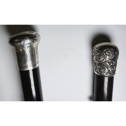 150 - Two Victorian ebony walking canes with hallmarked silver mounts, 83 and 90cm (2).