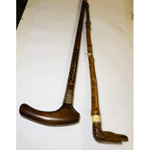 166 - A vintage wooden stick with dog's head handle and another with chequer work decoration, 86 and 94cm ... 