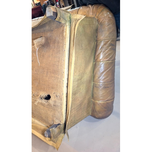 1100 - A very large late 19th/early 20th century tan hide scroll arm and back Chesterfield settee with butt... 