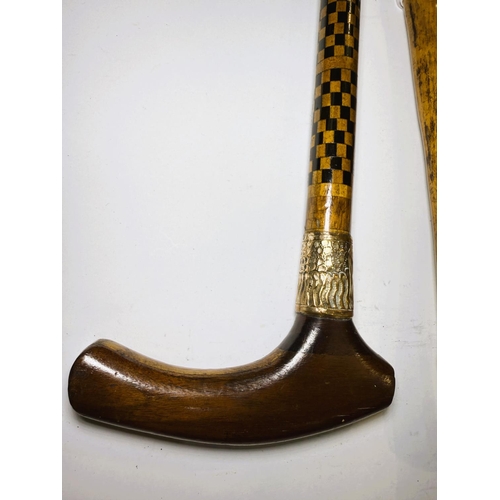 166 - A vintage wooden stick with dog's head handle and another with chequer work decoration, 86 and 94cm ... 