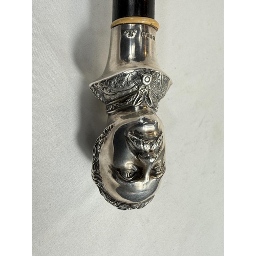 227 - A Victorian ebonised walking stick with silver portrait bust finial of General Gordon, London, 1885,... 