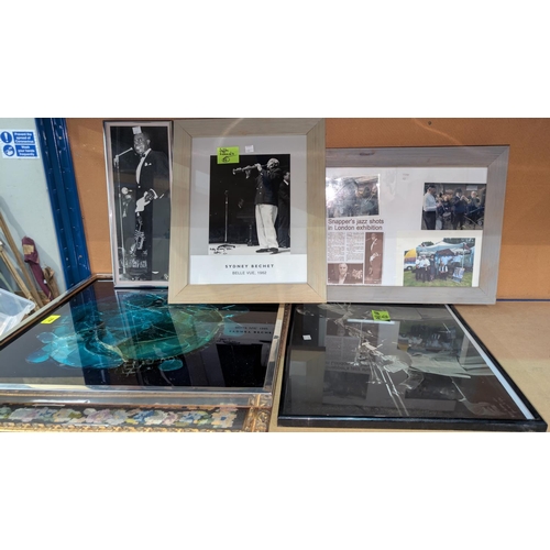 400 - A glass picture; a needlework picture and various  photos of Jazz musicians by a famous photographer... 