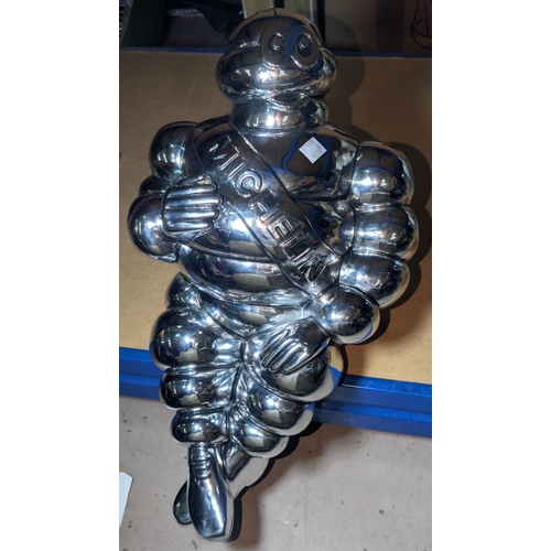 480A - A silvered 'Michelin Man' advertising figure, height 44cm.