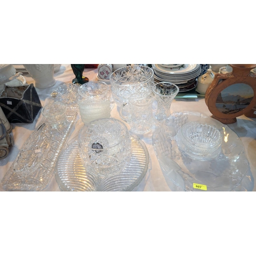 607 - A large selection of cut glass bowls, dishes, jugs etc.