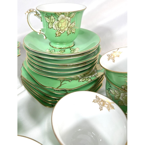 640 - A NORITAKE green enamelled porcelain tea service, a selection of blue and white and other meat platt... 