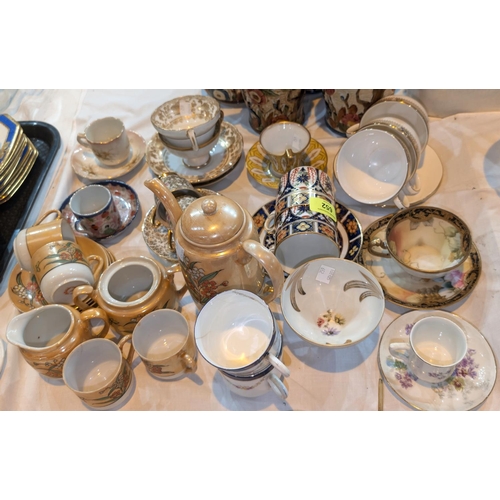 652 - A pair of Royal Crown Derby style cups and saucers and other cabinet cups and saucers.No bids sold w... 