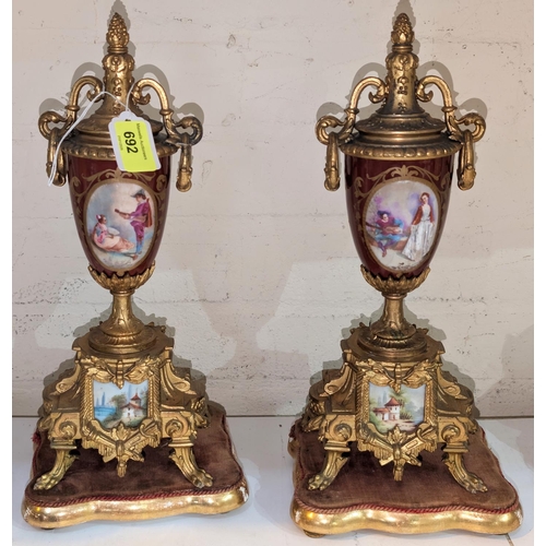 692 - A pair of ornate 20th century ormolu and porcelain urns in the Louis XVI style on detachable bases, ... 