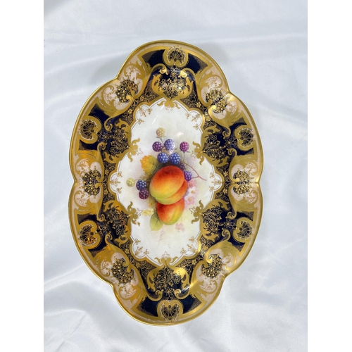 696 - Royal Worcester: an oval porcelain fruit dish decorated with peaches and blackberries, signed A SHUC... 