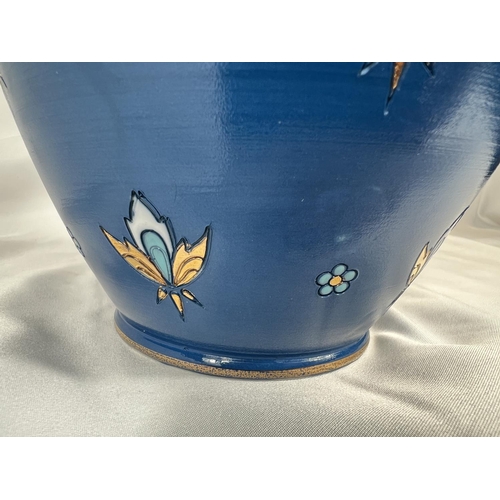 711 - A Mettlach blue ground baluster vase with stylised floral motifs, impressed mark, ht. 23cm