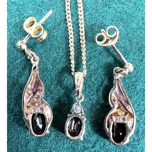 719 - A 9ct gold pendant  and earrings set with blue stone, 4.9gms