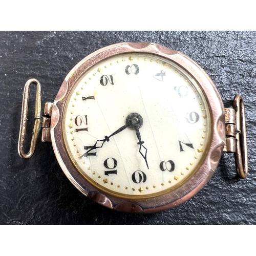 720 - An early 20th century 9ct gold cased lady's wristwatch, weight of back 2gms, stamped 375; a gilt bro... 