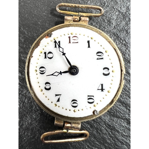 720 - An early 20th century 9ct gold cased lady's wristwatch, weight of back 2gms, stamped 375; a gilt bro... 