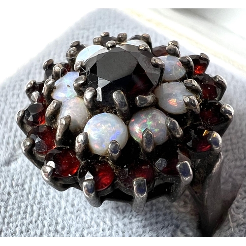 722 - A hallmarked silver ring with garnets and opals in floral setting and a selection of costume jewelle... 