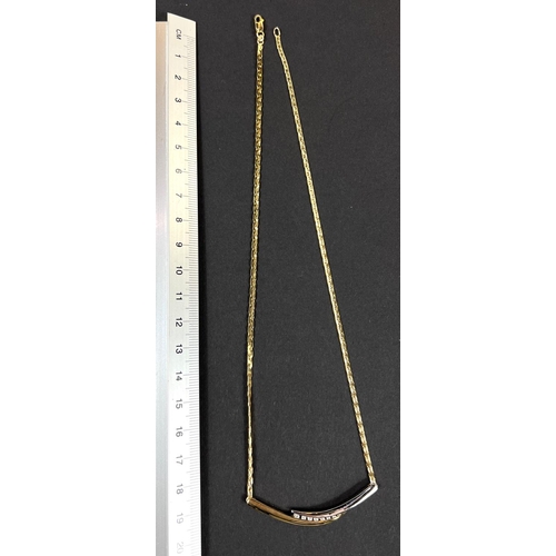 726 - A modernist 2 colour pendant set with 8 small diamonds on flattened link chain, stamped 750 and a ma... 