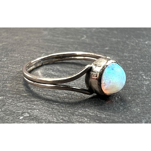 753 - An unmarked dress ring set with an opal, 1 gm, size K (tests as circa 9ct)